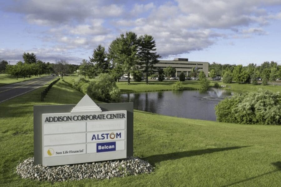 Addison Corporate Center sign by pond